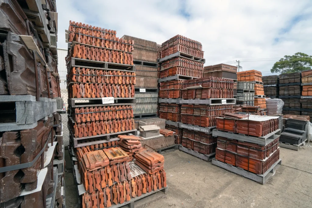 Bulk recycled roof tiles stored in warehouse